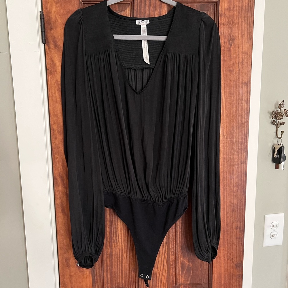 Free People black long sleeved thong body suit